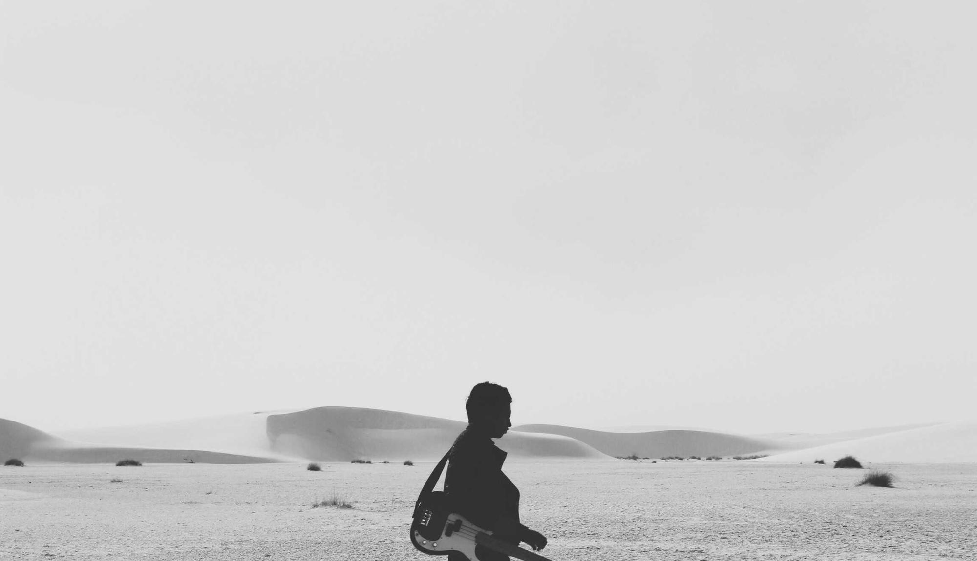 A pale memory of a figure by the sea